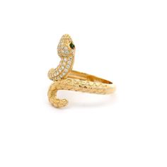 Infuse a touch of boldness and elegance with our snake ring. The intricate snake design features a sparkling head adorned with cubic zirconia stones and piercing green eyes, all set in 14k yellow gold. A stunning accessory that will make heads turn and spark conversations! Metal: 14k Gold Stone: Cubic Zirconia Type: Ring Size: 8 We size up to two sizes free of charge. Please contact us for pricing on resizing more than two sizes. We need 2-3 business days to resize this ring. We do not accept re Elegant Yellow Gold Snake Ring, Luxury 14k Gold Snake-shaped Ring, Elegant Snake-shaped Rings For Anniversary, Luxury Yellow Gold Snake Shaped Ring, Formal Diamond Snake-shaped Ring, Yellow Gold Diamond Ring In Snake Shape, Elegant Snake-shaped Anniversary Rings, Formal Yellow Gold Snake Ring, Luxury Snake-shaped Diamond Ring