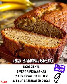 a loaf of banana bread sitting on top of a cutting board next to some bananas