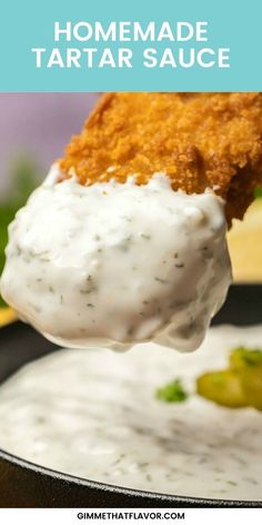 homemade tartar sauce is being held up over a skillet with the recipe in it