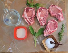 raw meats are displayed on a piece of wax paper next to salt and pepper