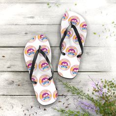 All-day comfort is the name of the game when summer is on. These flip flops can add some character to your summer escapades. With an easy slip-on design, a cushioned footbed, and top-tier printing fidelity, these flip flops are a guaranteed summer hit. .: Materials: EVA, polyester, PVC .: 5/8" (15 mm) thick EVA sole with a textured bottom .: 100% polyester suede sole cover .: Black PVC strap .: Runs true to size .: Multiple sizes White Flip Flops For Beach Season, Retro Multicolor Sandals For The Beach, Adjustable Fun Flip Flops For Beach, Fun White Flip Flops For Vacation, Fun Flip Flops For Beach Season Swimming, Fun Flip Flops For Beach Season, Fun Beach Season Flip Flops For Swimming, Fun White Flip Flops For Beach, Fun White Flip Flops For The Beach