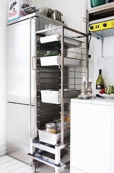 an open refrigerator in a kitchen next to a counter