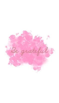 the words be grateful written in pink ink on a white background with watercolor stains