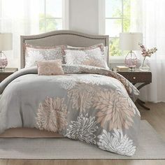 the comforter is made up with flowers on it