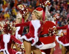 the cheerleaders are dressed in santa costumes