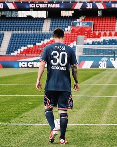 a soccer player is walking on the field