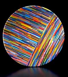 a round object with multicolored lines on it