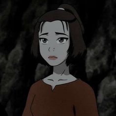 an animated image of a woman with dark hair and brown shirt looking at the camera