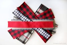 four red and black plaid fabric pieces tied together