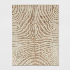 a piece of wood with zebra print on the top and bottom part, in light brown