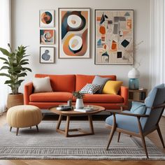 a living room filled with furniture and paintings on the wall above it's coffee table