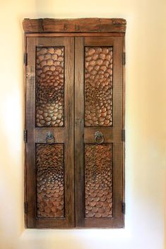 an old wooden door with carvings on it