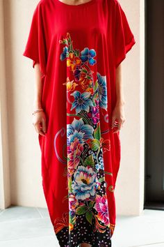 This elegant red dress is adorned with beautiful and delicate bougainvillea, peony and lilies. It is perfect for those days when you just feel feminine and powerful. The caftan fits women sized XS to 3XL. The beautiful model Lucya usually wears size S/M. Red Floral Print Long Maxi Dress, Floral Print Short Sleeve Kaftan, Vibrant Red Floral Print Maxi Dress, Vibrant Red Maxi Dress With Floral Print, Elegant Red Floral Print Kaftan, Tropical Red Floral Print Maxi Dress, Tropical Red Maxi Dress With Floral Print, Red Tropical Short Sleeve Dress, Spring Red Maxi Length Kaftan