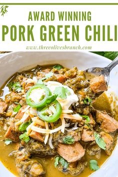 a white bowl filled with green chili and meat