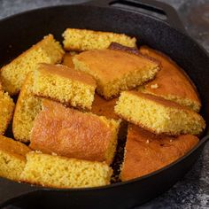 cornbread in a skillet with slices cut out