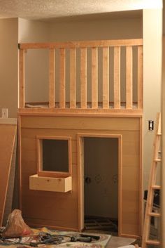 an unfinished loft with stairs and ladders