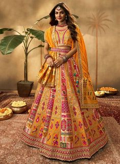 Yellow and pink banarasi silk bridal lehenga choli 10280Desc:  Style : Circular Lehenga Choli Color : Yellow and Pink Fabric : Banarasi silk  Work : zari weaving and and Embroidery Wash Care : Dry clean Sleeve Style : Half Sleeve Long Sleeves : Done only in Custom Stitch Sleeves Lining : Done only in Custom Stitch Bust Size : 32 to 42 Inches Occasion : Wedding   Mehendi   Engagement   Reception   Ceremonial   Baby Shower   Party WearSemi stitch lehenga choli.Size till 42 inch.silk lehenga choli . With Express Free Shipping and Custom Stitching, Buy Lehenga - Indian Party wedding and bridal  Yellow and pink banarasi silk bridal lehenga choli 10280 online in USA, UK and Canada from KollyBollyEthnics.com Lehenga Banarasi, Yellow Bridal Lehenga, Festive Yellow Banarasi Silk Choli, Yellow Banarasi Silk Choli For Festivals, Yellow Embroidered Banarasi Silk Choli, Yellow Banarasi Lehenga, Yellow Lehenga With Pink Dupatta, Lehenga Style Saree, South Silk Sarees