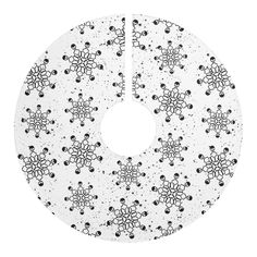 a white cake plate with black and white snowflakes on the bottom, surrounded by dots