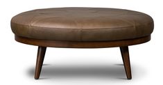 a brown leather ottoman sitting on top of a wooden frame