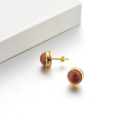 Lewa (Enduring Beauty) The Lewa earrings embody the simplicity of beauty that is timeless, featuring a significant gemstone that is encased within 9.2mm x 9.2mm sterling silver. Dimensions Earring size: 9.2mm x 9.2mm x 3.4mm Gemstone size: 8mm x 8mm Weight: 1.4g Material: 92.5% Sterling Silver Plating: Gold, Silver, Rose Gold Dainty Polished Everyday Earrings, Dainty Everyday Earrings With Polished Finish, Everyday Polished Finish Fine Jewelry Earrings, Timeless Gemstone Earrings For Anniversary, Nickel-free Fine Jewelry Earrings For Everyday, Minimalist Jewelry With Polished Round Stone, Timeless Round Jewelry With Matching Earrings, Classic Rose Gold Gemstone Earrings, Nickel-free Minimalist Jewelry For Formal Occasions