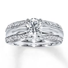 a white gold ring with diamonds on it