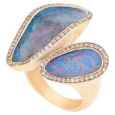 Presenting a chic rose gold ring that seamlessly blends couture and fashion. This captivating piece features two opal stones, each exhibiting a mesmerising play of colours, set in a sleek bezel. Surrounding the opals are round-cut diamonds in a delicate pavé setting, adding a touch of brilliance. Gross weight: 13.3 g Diamond weight: 0.36 cts Luxury Yellow Gold Opal Ring With Gemstone Accents, Luxury Yellow Gold Opal Ring, Luxury Diamond Opal Ring With Gemstone Accents, Luxury Opal Ring With Diamond And Gemstone Accents, Luxury Opal Rings With Gemstone Accents, Luxury 14k Gold Opal Ring, Luxury Multi-stone Opal Ring In 14k Gold, Luxury Opal Ring With Gemstone Accents For Anniversary, Luxury Opal Rings With Gemstones