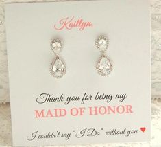 a pair of earrings with thank you for being my maid of honor