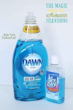 a bottle of dawn liquid next to a container of laundry detergent on a white surface