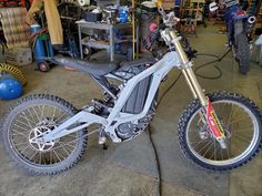 a dirt bike is parked in a garage