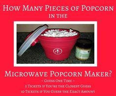 a red bucket filled with popcorn sitting on top of a counter