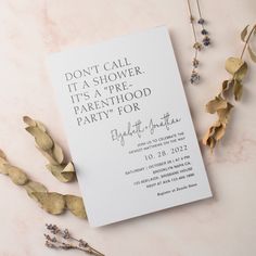 a white card with the words don't call it a shower, it's a parenthood party for