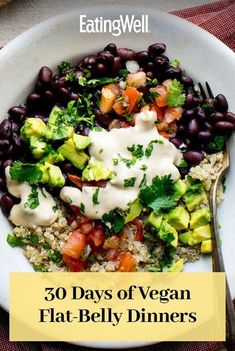 a white plate topped with black beans and veggies