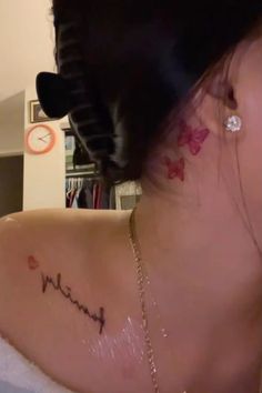 the back of a woman's neck with her name written on it