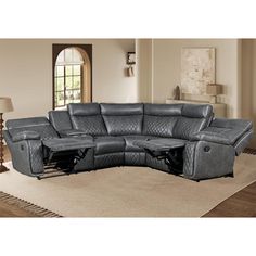 a living room with a sectional couch and recliner