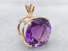 This amethyst gem is bursting with brilliant purple color! The round cut faceting optimizes its luster, and the yellow gold only compliments the stone with its warm hue. This pendant could be worn everyday or for special occasions! Amethyst, Amethyst Gemstone, Amethyst Birthstone, February Birthstone, Purple Stone, Purple Gemstone, AmethystMetal: 14K Yellow Gold Gem: Amethyst 10.67 Carats Gem Measurements: 14.7 mm, RoundMeasurements: 14.7 x 21.4 mm, with bail Faceted Yellow Gold Amethyst Ring, Faceted Amethyst Ring In Yellow Gold, Amethyst Gemstones In Yellow Gold With Prong Setting, Amethyst Gemstones In Prong Setting - Yellow Gold, Round Faceted Purple Gemstones, Faceted Round Purple Gemstones, Purple Gemstones In 14k Gold, Round Shaped, Purple Round Gemstones In 14k Gold, Round Amethyst Ring With Diamond Cut