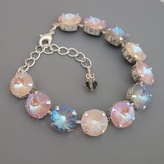 "♡ Genuine Austrian crystals ♡ 12mm round Rivolis (1/2\") ♡ Colors: Dusty Pink Delite, Ivory Cream Delite, Serene Gray Delite ♡ Shiny Silver plated (nickel free) ♡ Adjustable from 6 1/2\" - 8 1/2\"  ♡ Lobster claw clasp ♡ 2\" extender chain with crystal charm ♡ Matching earrings available ♡ Handcrafted with love and attention to detail" Faceted Round Crystal Bracelet, Adjustable Crystal Bracelet With Sparkling Stones, Crystal Charm, Austrian Crystal, Shiny Silver, Adjustable Bracelet, Dusty Pink, Antique Copper, Crystal Bracelets