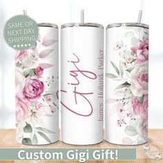 three personalized tumbles with flowers on them and the words, custom gigi gift