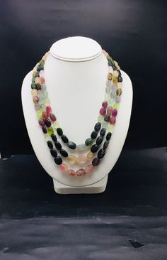 100% Natural Multi Tourmaline hand carved oval shape beaded necklace with adjustable silk cord closure.  Details: - Gemstone - multi-Tourmaline Shape - Oval  Strand - 3 Calibration - 9x11 millimeters till 12x16 millimeters Gross weight - 838.05 carat Net weight - 811.05 carat Length - 17 Inches (Inner) and 20 Inches (Outer) SKU - HJSPSAR0037 100% NATURAL TOURMALINE BEADS READY TO WEAR NECKLACE ADJUSTABLE SILK CORD CLOSURE  VERY NICE LOOKING NECKLACE MULTI-COLORS OF NATURAL TOURMALINE Thank you for your kind visit to my shop. NOTE: - You will receive the same product you see in the picture.   Dear Buyers, please feel free to ask questions    We will be glad to answer & solve query regarding this product RETURN POLICY: -   Every piece of jewelry and inputs ( gemstones, diamonds, making, and Oval Multicolor Multi-stone Necklaces, Multicolor Oval Multi-stone Necklace, Multicolor Multi-stone Oval Necklace, Multicolor Multi-stone Oval Necklaces, Oval Tourmaline Natural Gemstones, Oval Tourmaline Gemstones, Multicolor Oval Beads Gemstone Necklaces, Oval Multicolor Natural Stones Gemstones, Indian Customs