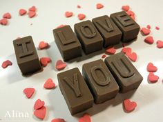 chocolate letters spelling i love you surrounded by hearts