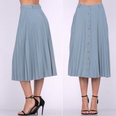 Oooo La La! This Skirt Is Perfect For The Spring, Summer Or Fall. Features: - Botton Down Front Closure - Pleated Design - Tailored Waist - Belt Loop Accent( No Belt Included) - Flowy Skirt - Lightweight - Midi Length Fabric: 100% Matte Polyester Fit: True To Size Women. Fitted At Waist Then Flowy Lower Blue Knee-length Bottoms With Button Closure, Fitted Pleated Skirt With Buttons For Spring, Casual Midi Skirt With Button Closure For Day Out, Midi Length Bottoms With Button Closure For Day Out, Casual Midi Bottoms With Button Closure For Day Out, Blue Buttoned Skirt, Blue Knee-length Skirt With Button Closure, Blue High-waisted Skirt With Button Closure, High Waist Blue Skirt With Button Closure