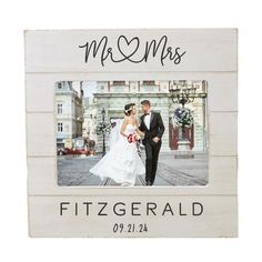 a wedding picture frame with a bride and groom