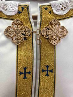 Enhance your religious garments with exquisite gold clasps. Ideal for vestments, cassocks, priest robes, and phelons, these high-quality clasps provide a secure and elegant touch to any ecclesiastical attire. Size: One side of the clasp 4 cm For orders of 6 units or more, we can offer a better price and free shipping! Gold Embroidered Chasuble For Weddings, Gold Wedding Chasuble With Gold Embroidery, Traditional Gold Ceremonial Chasuble, Priest Robes, A Cross, Ukraine, Bathing Beauties, Accessory Gift, Electronic Accessories