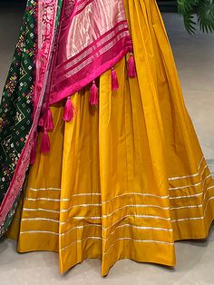 Introducing our stunning mustard yellow cotton plain lehenga choli with dupatta, a beautiful traditional ensemble that is perfect for festivals, events, and occasions. Crafted with utmost care, this lehenga choli exudes elegance and grace with its mustard yellow color and intricate details.
One of the key highlights of this outfit is the cotton material used, providing comfort and breathability for long hours of wear. The lehenga features a mesmerizing gota patti touch-up work, adding a touch of Cotton Lehenga With Gota Work For Wedding, Cotton Semi-stitched Lehenga With Gota Work, Cotton Lehenga With Gota Work, Semi-stitched, Semi-stitched Cotton Lehenga With Traditional Drape, Traditional Cotton Lehenga With Gota Work, Anarkali Style Cotton Choli With Gota Work, Festive Cotton Choli With Gota Work, Bollywood Style Semi-stitched Cotton Lehenga, Cotton Floor-length Sets For Festivals