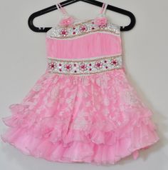 Regular Price - $39.99 Sale Price - $29.99 (after 25% discount) With this elegant Pink Dress your little princess is sure to steal the show designed with bead, embroidery colored stone work and flower pattern work. The dress has the inner satin lining Size  Dress Length  - 24 inches Bust Size - 22 inches (round length - front+back) - This is the width of the dress just below  the arm hole Suitable from 2.5 to 4.5 years. The age provided is just a suggestion. Please check the exact measurements p Embellished Princess Dress For Dress-up, Spring Festive Princess Dress With Ruffles, Sleeveless Summer Pageant Dress, Spring Embellished Princess Dress For Dress-up, Fitted Floral Applique Princess Dress For Dress-up, Fitted Summer Pageant Dress With Ruffles, Summer Fitted Pageant Dress With Ruffles, Summer Pageant Dress With Ruffles, Summer Princess Sleeveless Pageant Dress