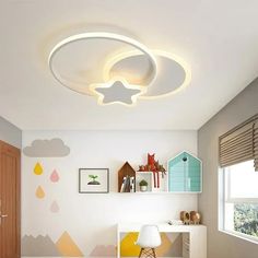 a child's room with white walls and colorful decorations