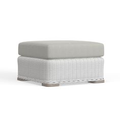 a white foot stool sitting on top of a white floor