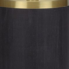 a black and gold canister is shown in this image