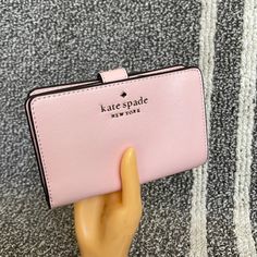 Kate Spade Staci Medium Compact Bifold Wallet Conch Pink Color: Conch Pink New With The Tag Authentic 4.5" H X 5.5" W X 1" D Saffiano Leather Ksny Metal Pinmount Logo Two Way Spade Jaquard Lining Interior: 8 Credit Card Slots, Id Window, 4 Slip Pockets, 2 Bill Folds Exterior: L-Zip Coin Compartment Snap Closure Dust Bag Not Included Imported Style # Kc580 #Chalk Pink Kate Spade Wallet Pink, Kate Spade Spring, Kate Spade Staci, Kate Spade Card Holder, Black Leather Wallet, Wallet Organization, Kate Spade Wallet, Black Wallet, Kate Spade Handbags