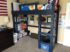 a bunk bed in a child's bedroom with bookshelves and other toys