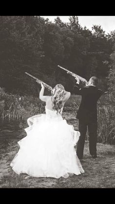 black and white wedding photo, women in big puffy white wedding gown shooting a camo patterned shotgun with male groom in black tuxedo shooting a camo patterned shotgun Country Couple Pictures, Bridesmaids Shoes, Cute Country Couples